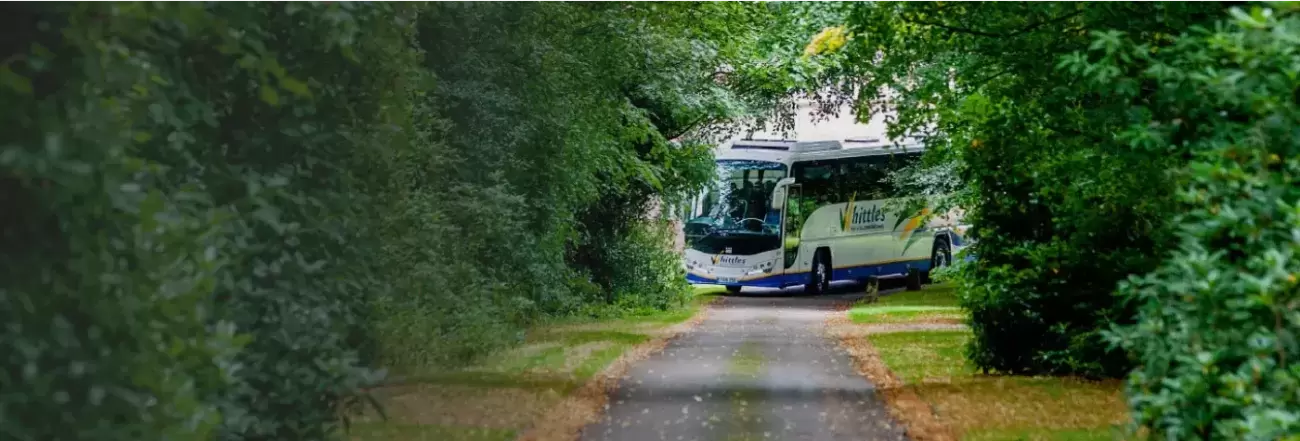 Whittles coach turning up lane