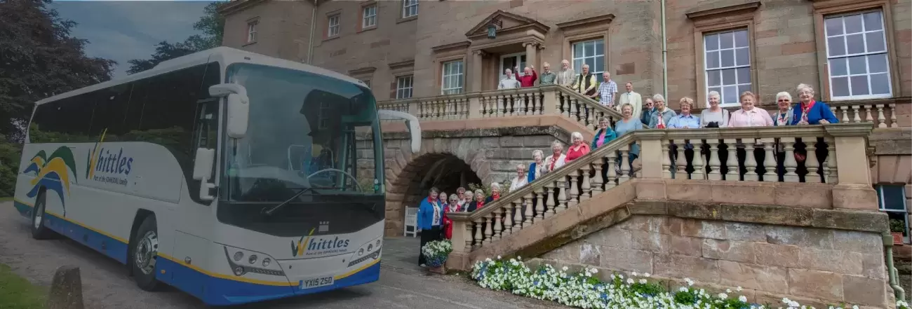 Whittles coach at stately home with people
