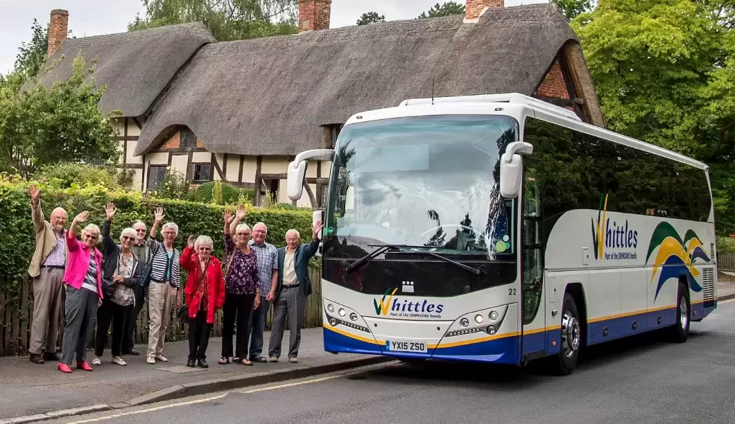 Whittles coach with people