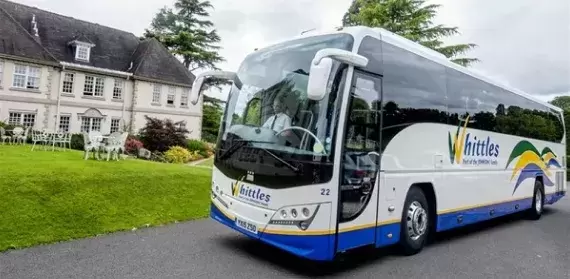 Whittles coach outside hotel